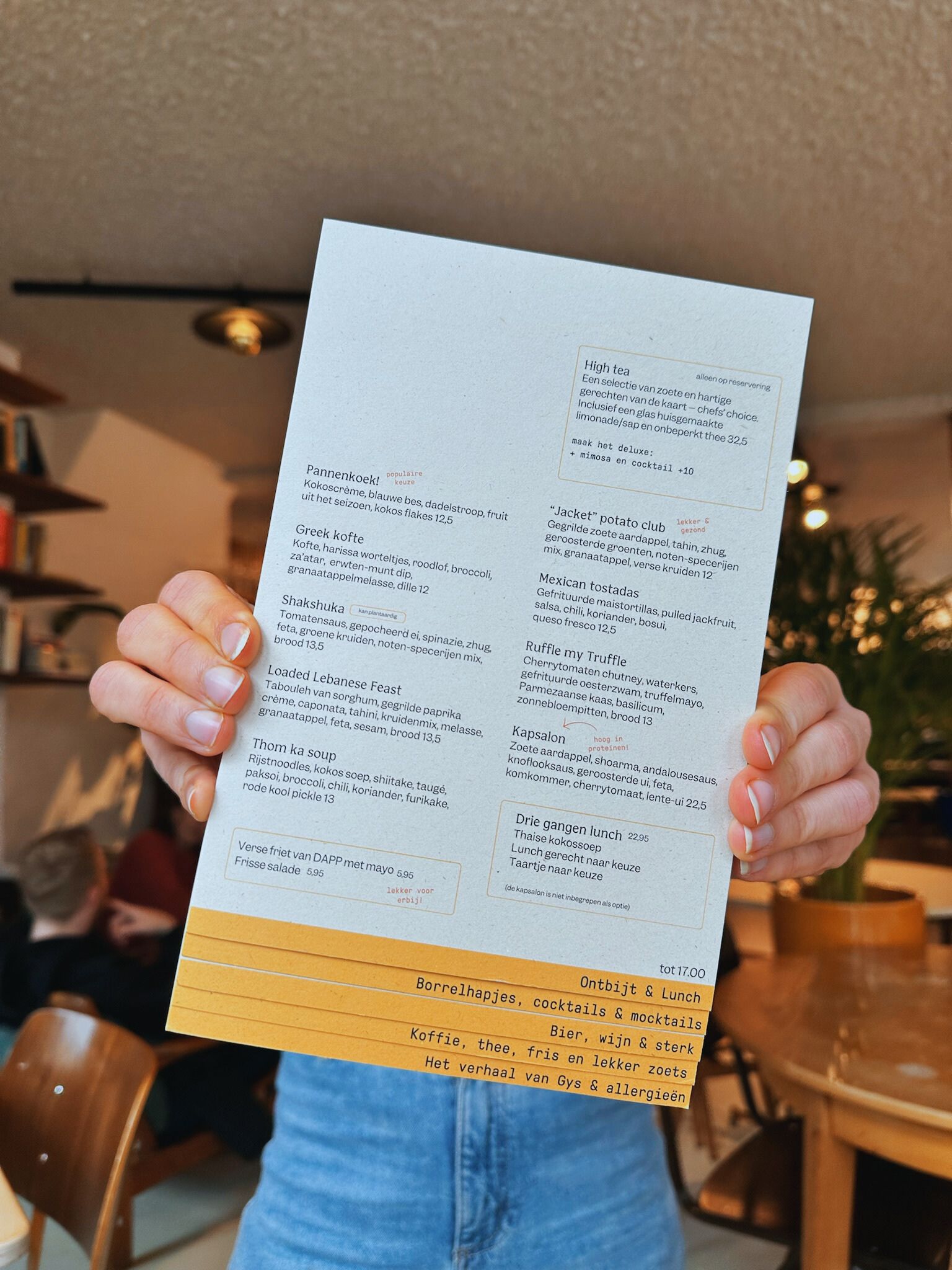 Someone holding a menu