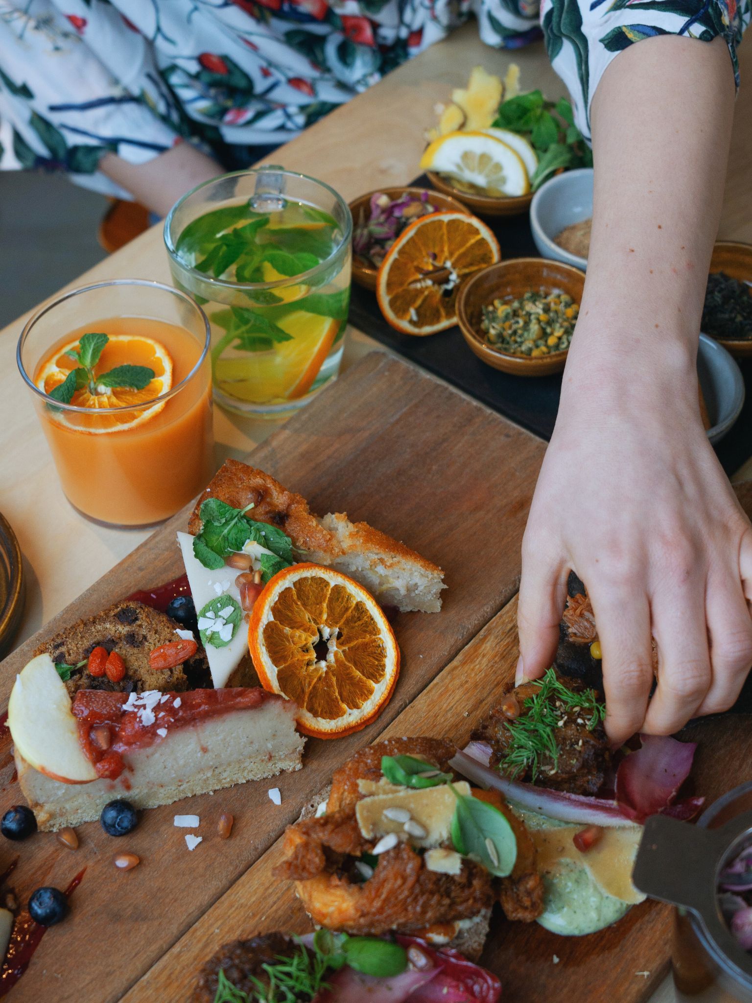 A hand reaches out to grab a bite of food